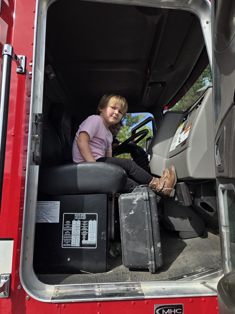 Caselynn sitting in the fire truck.