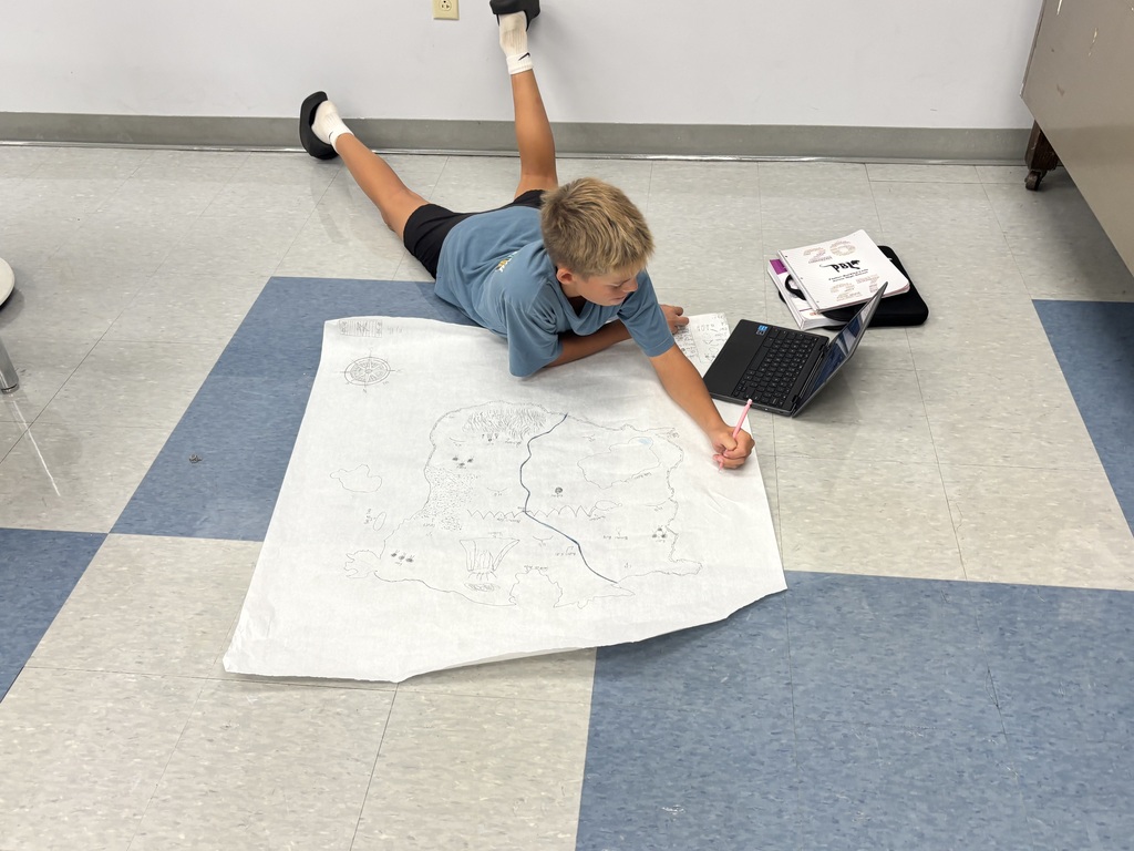 Student drawing on a map