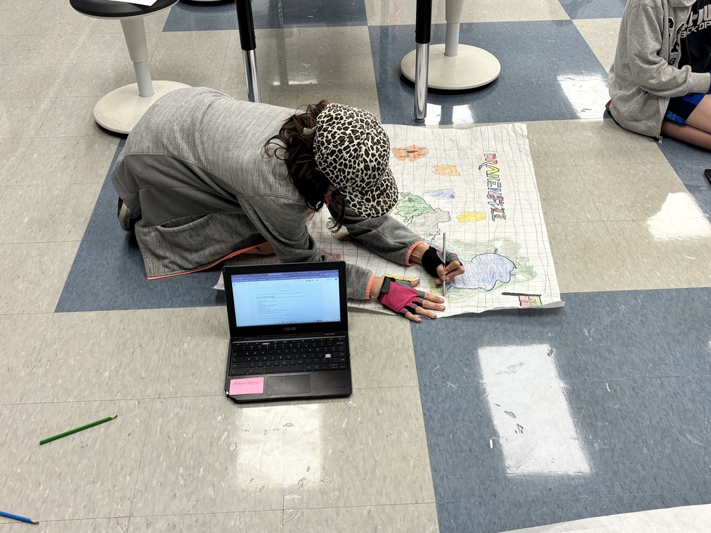 Student drawing on a map