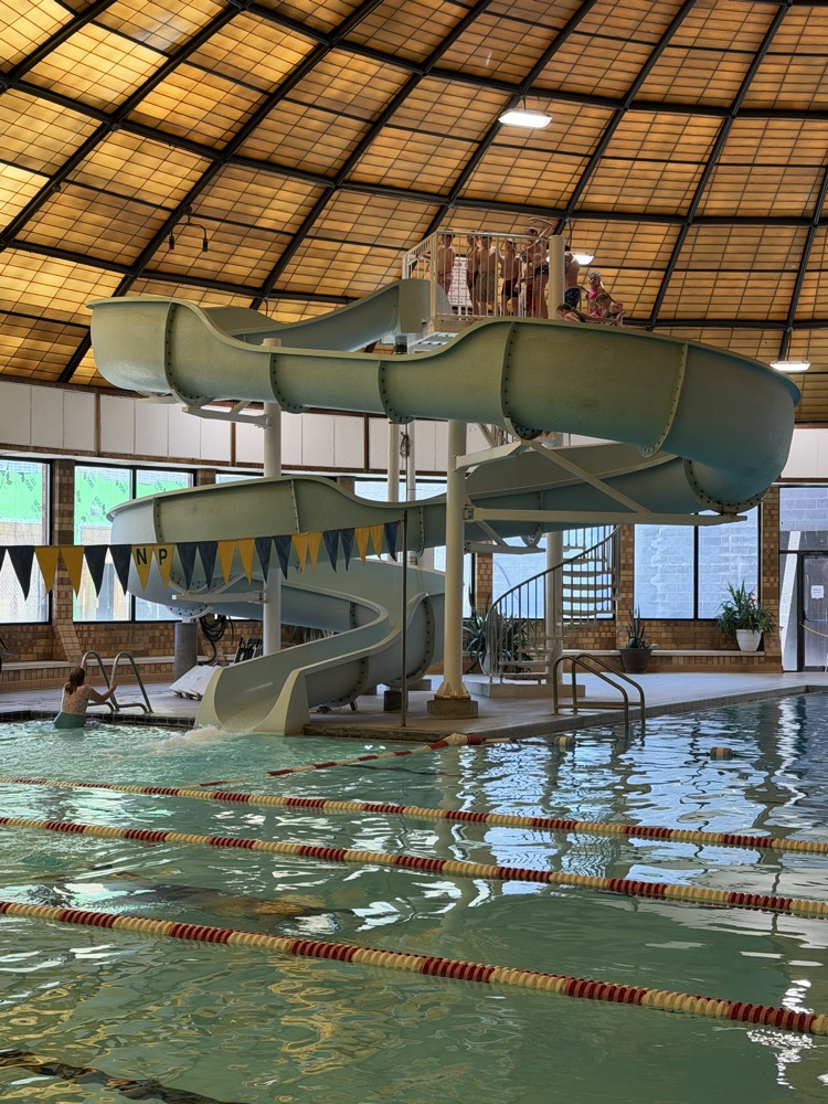 students enjoying the slide at the rec center  