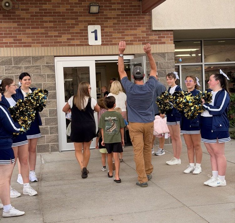 cheerleaders welcoming guests
