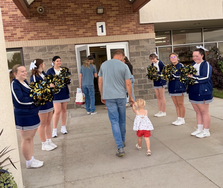 cheerleaders welcoming guests