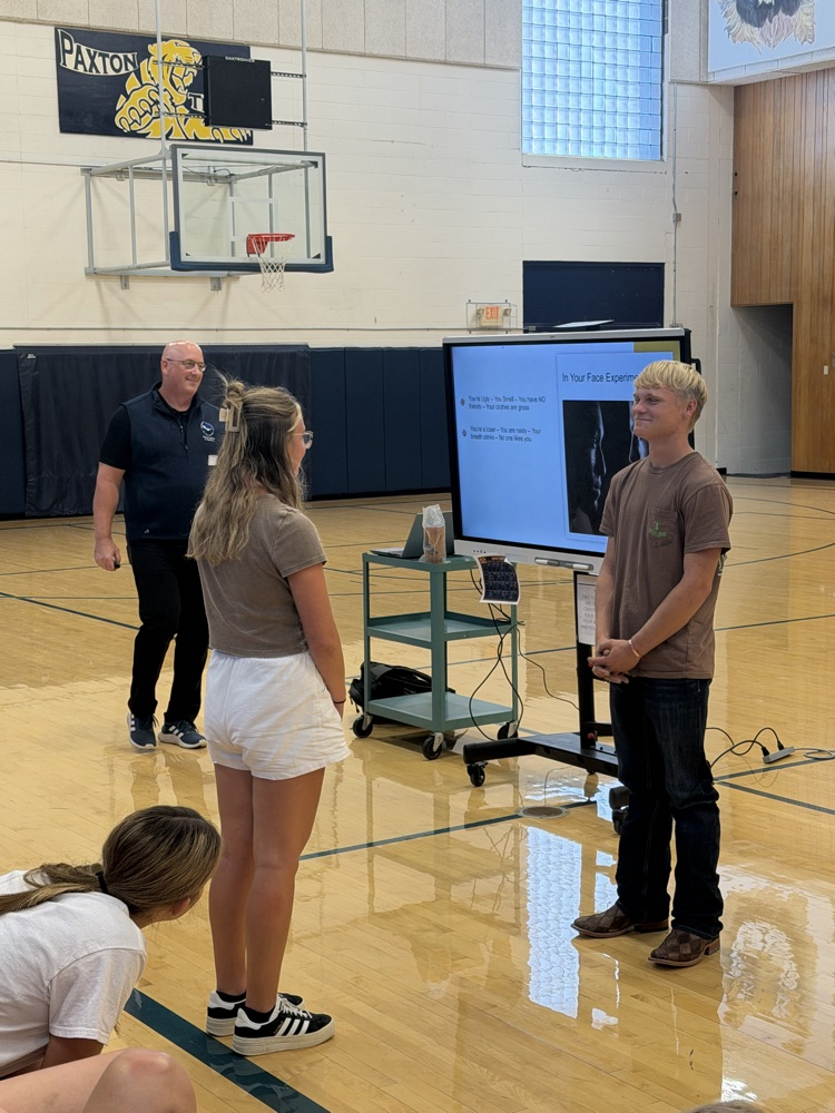 Landon and Natalie participating at presentation