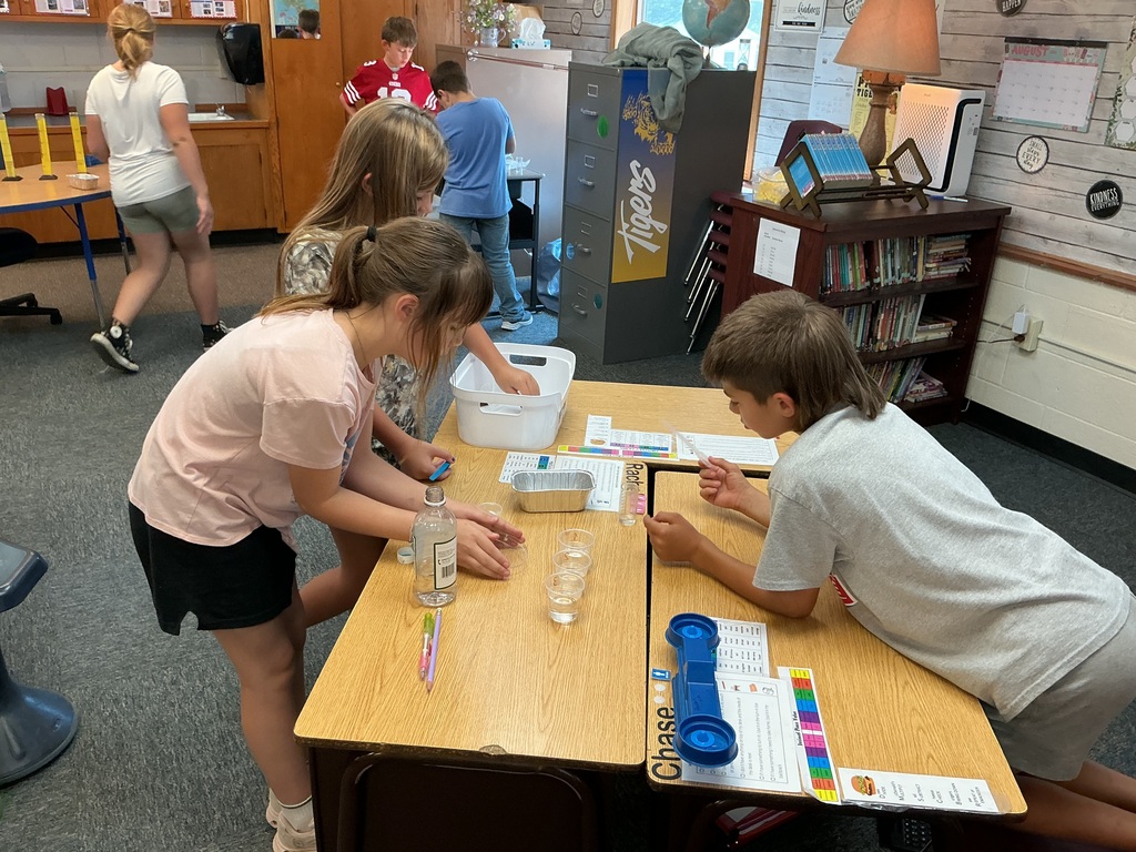 5th graders testing contaminated water samples during science