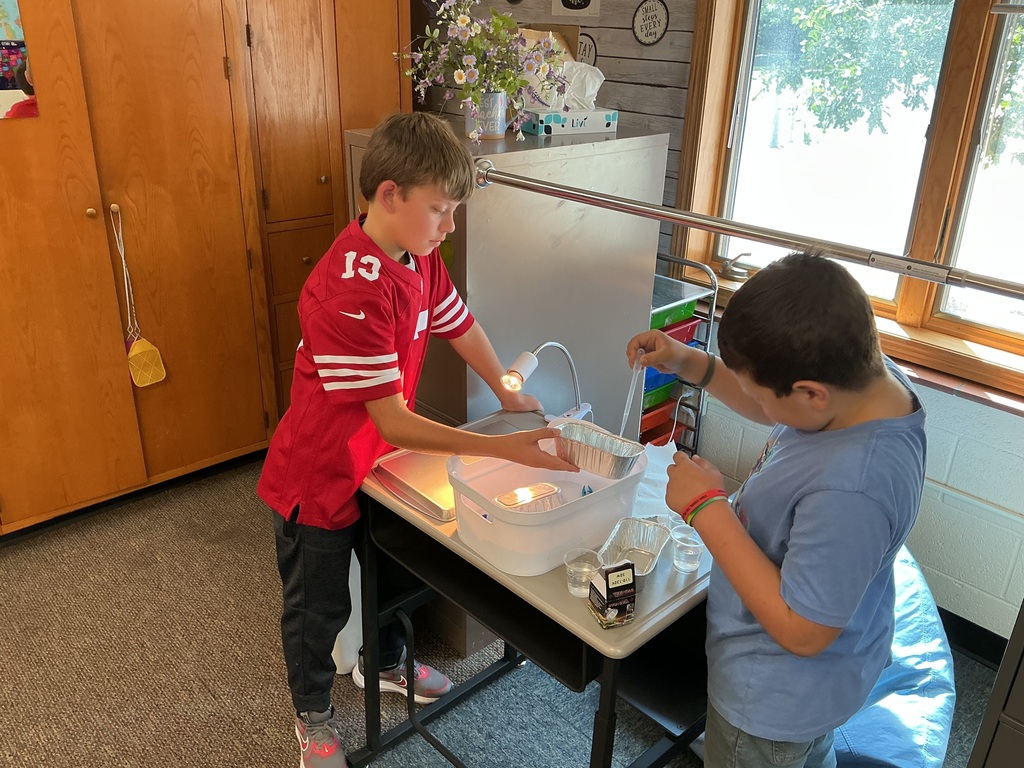 5th graders testing contaminated water samples during science