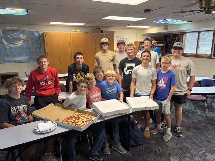 Paxton football team with pizza 