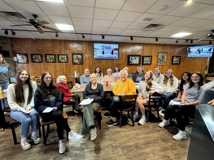 high school volleyball team visiting with the senior citizens at Ole’s during their luncheon 