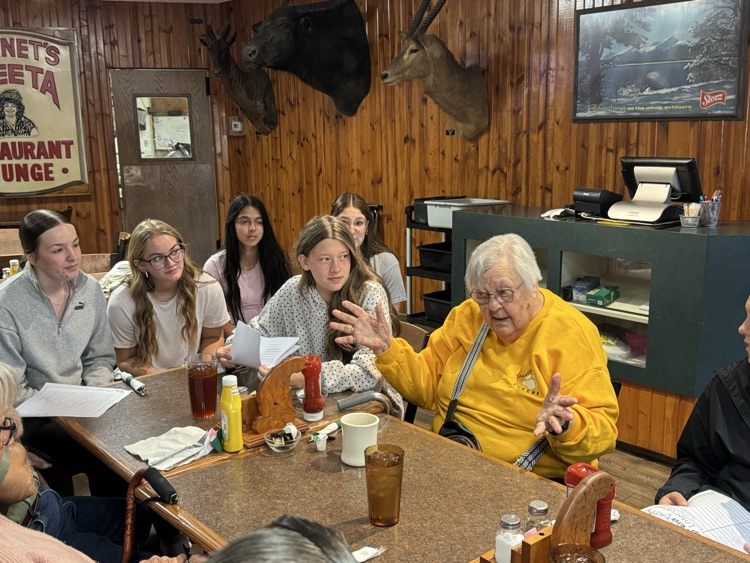 high school volleyball team visiting with the senior citizens at Ole’s during their luncheon 