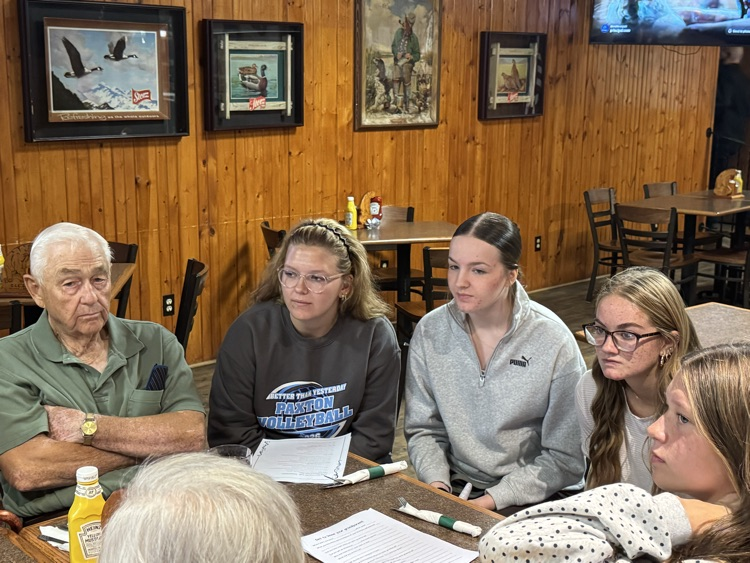 high school volleyball team visiting with the senior citizens at Ole’s during their luncheon 