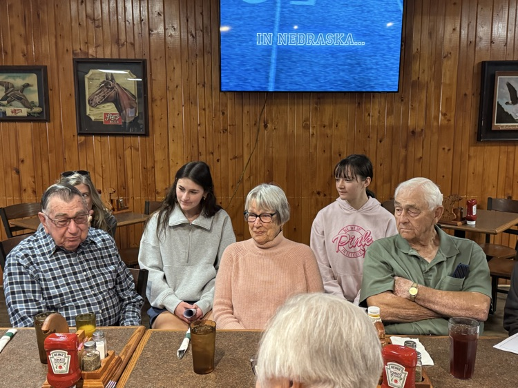 high school volleyball team visiting with the senior citizens at Ole’s during their luncheon 