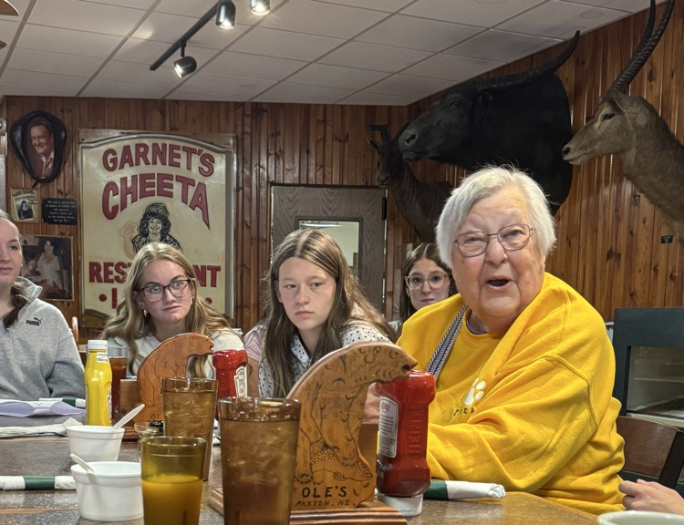 high school volleyball team visiting with the senior citizens at Ole’s during their luncheon 