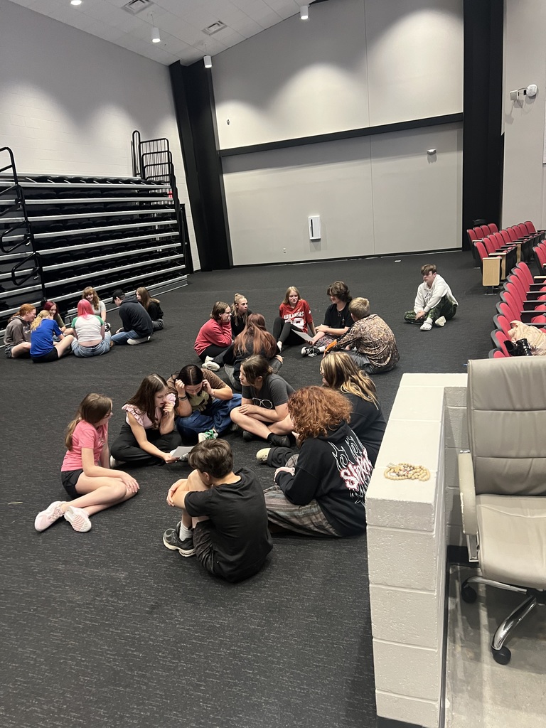 students in theatre working