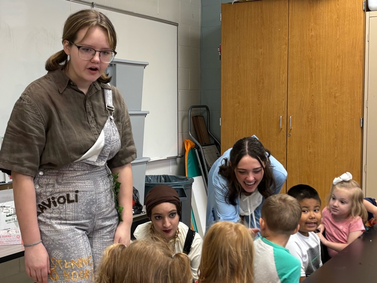 cast of Peter and Wendy reading to children