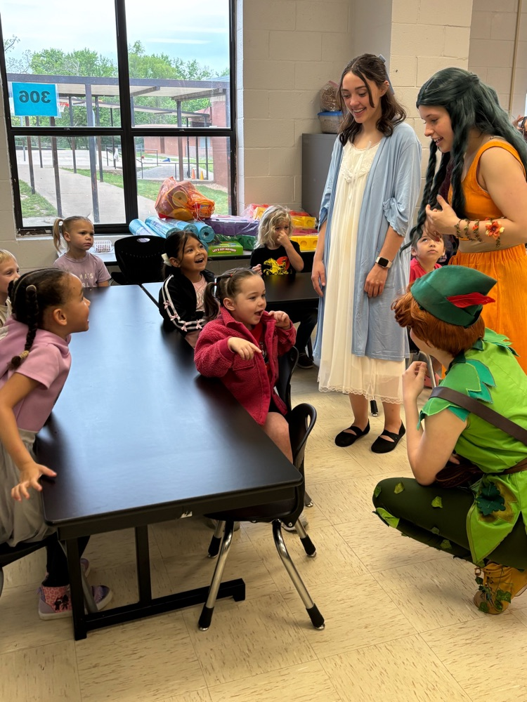 cast of Peter and Wendy reading to children
