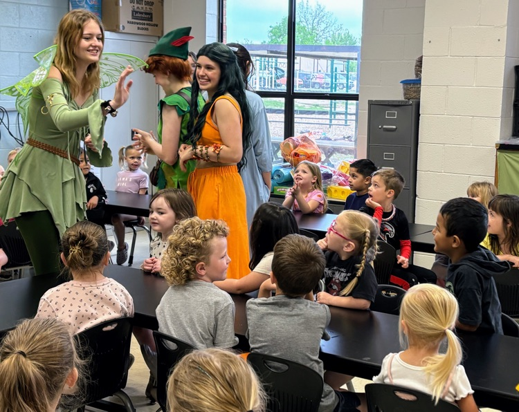 cast of Peter and Wendy reading to children