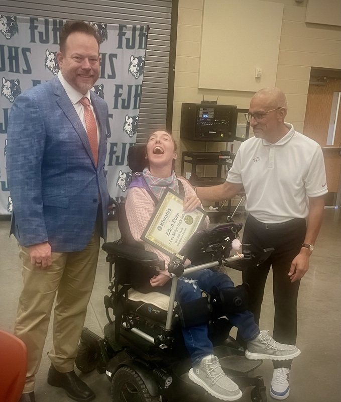 Eden receiving her award