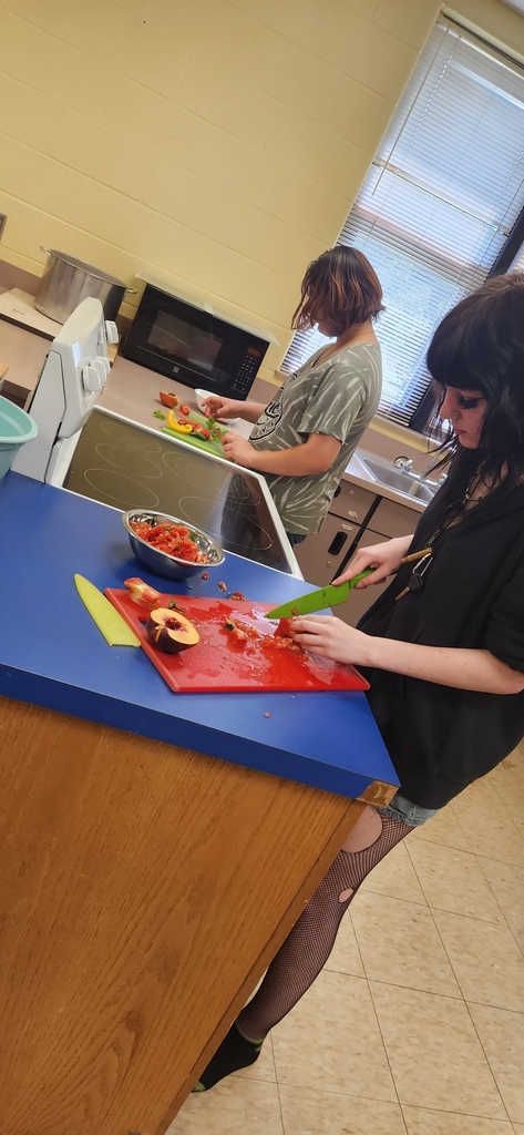 Students in Learning Labs making salsa with fresh tomatoes from Mr. Perry's garden