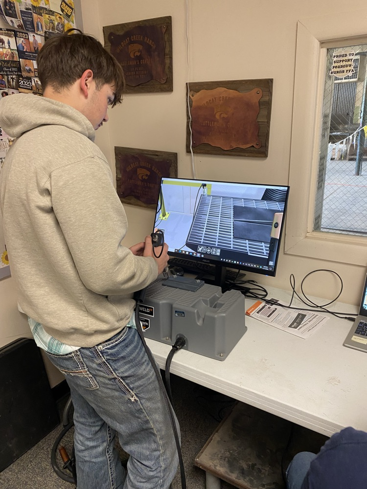 students using the virtual welding simulator