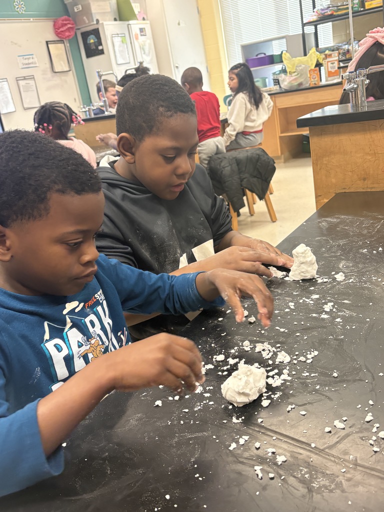 Students making snow in art class