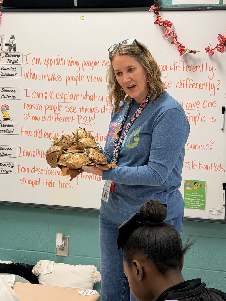 Students exploring Native American Artifacts