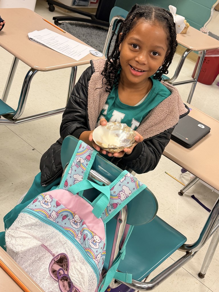 Students exploring Native American Artifacts