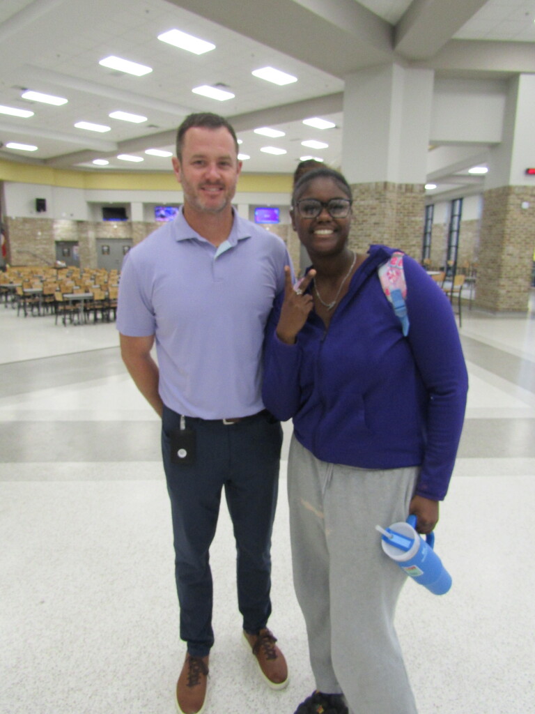faculty and students wearing purple and teal