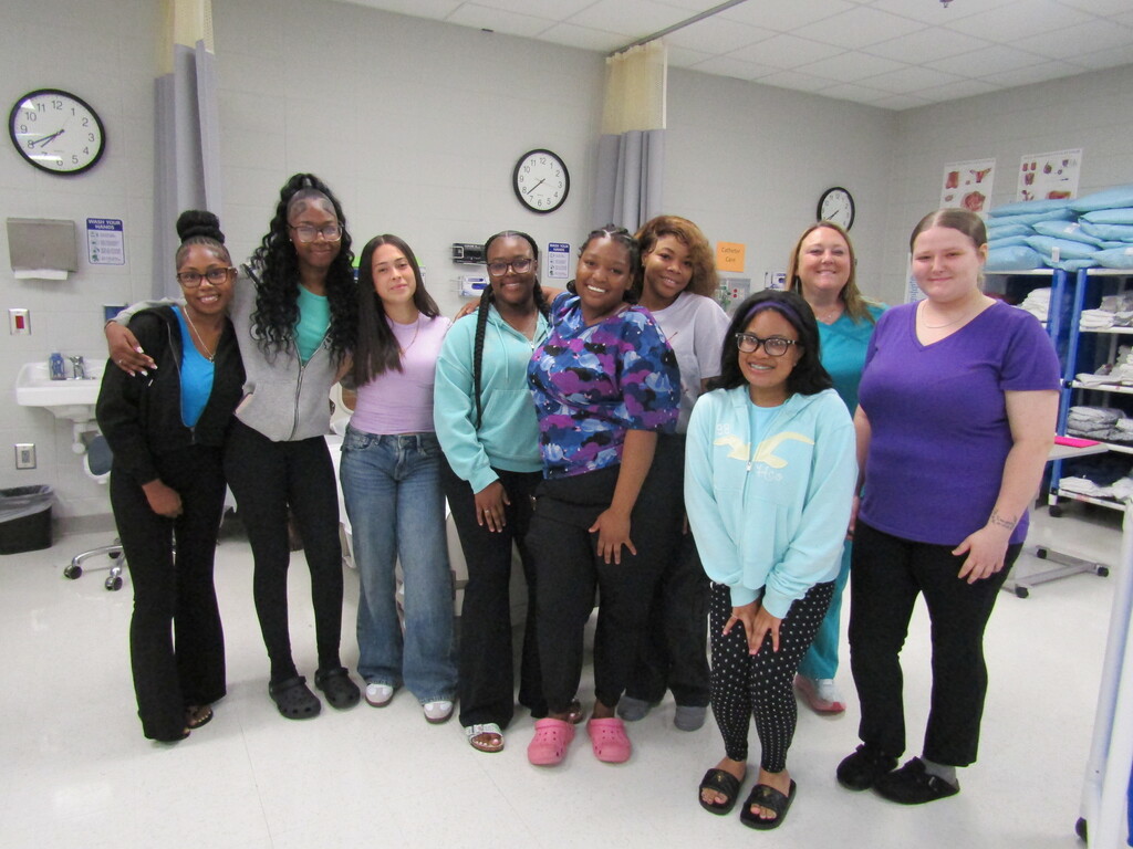 faculty and students wearing purple and teal