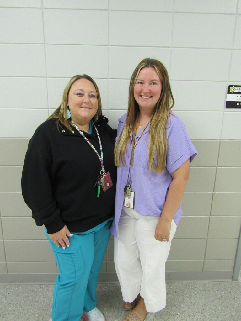 faculty and students wearing purple and teal