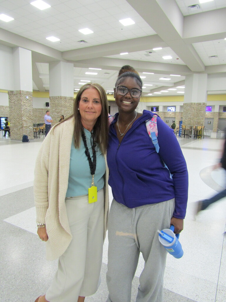 faculty and students wearing purple and teal
