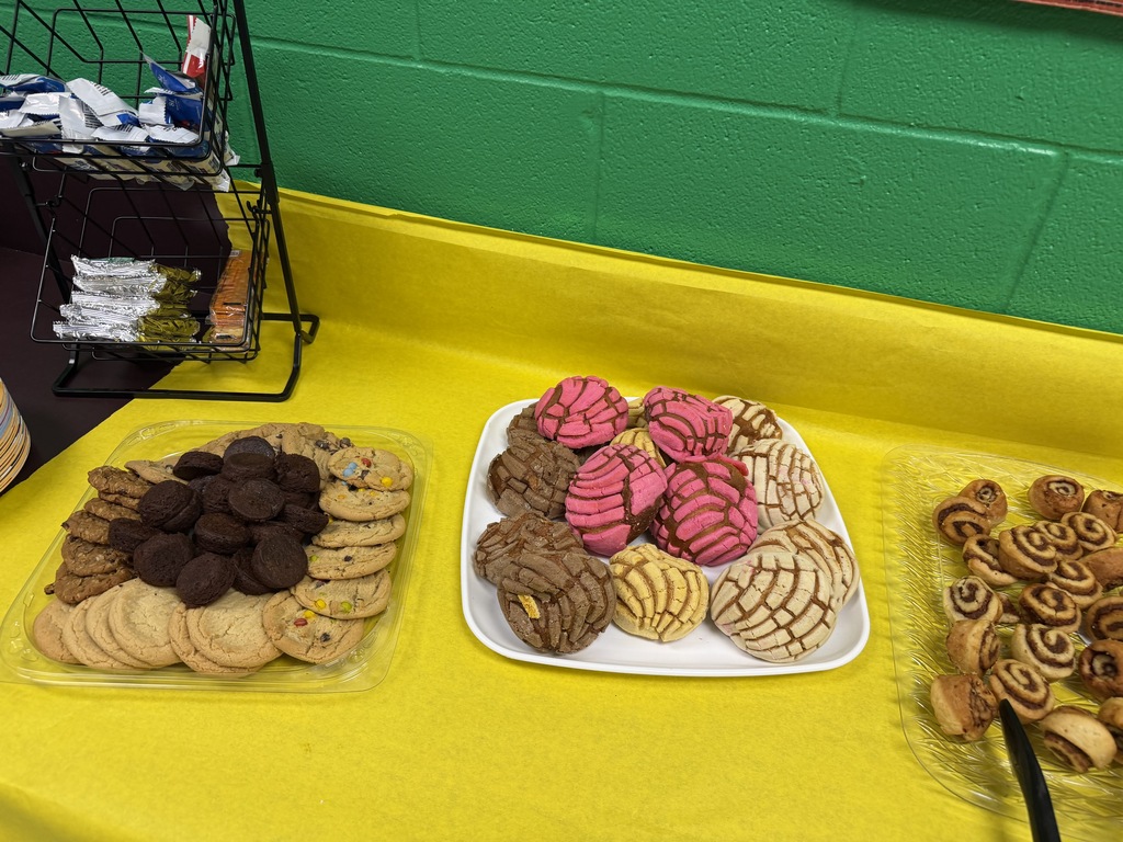 faculty and staff of PJH celebrating earning a B rating at breakfast