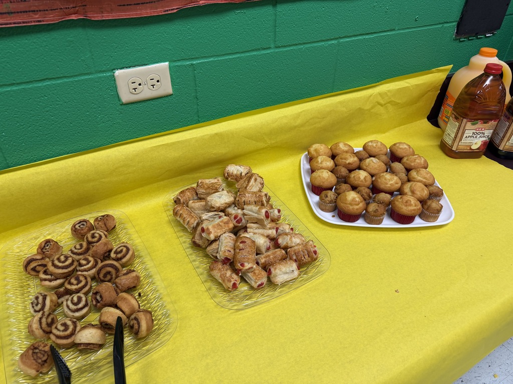 faculty and staff of PJH celebrating earning a B rating at breakfast