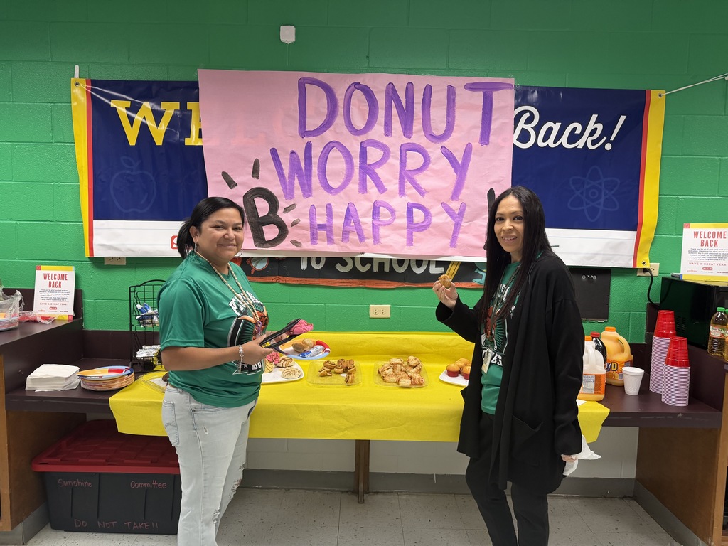 faculty and staff of PJH celebrating earning a B rating at breakfast