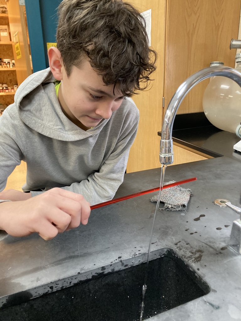 The 8th graders used an electrical force to move a stream of water without touching it in their Physical Science class.