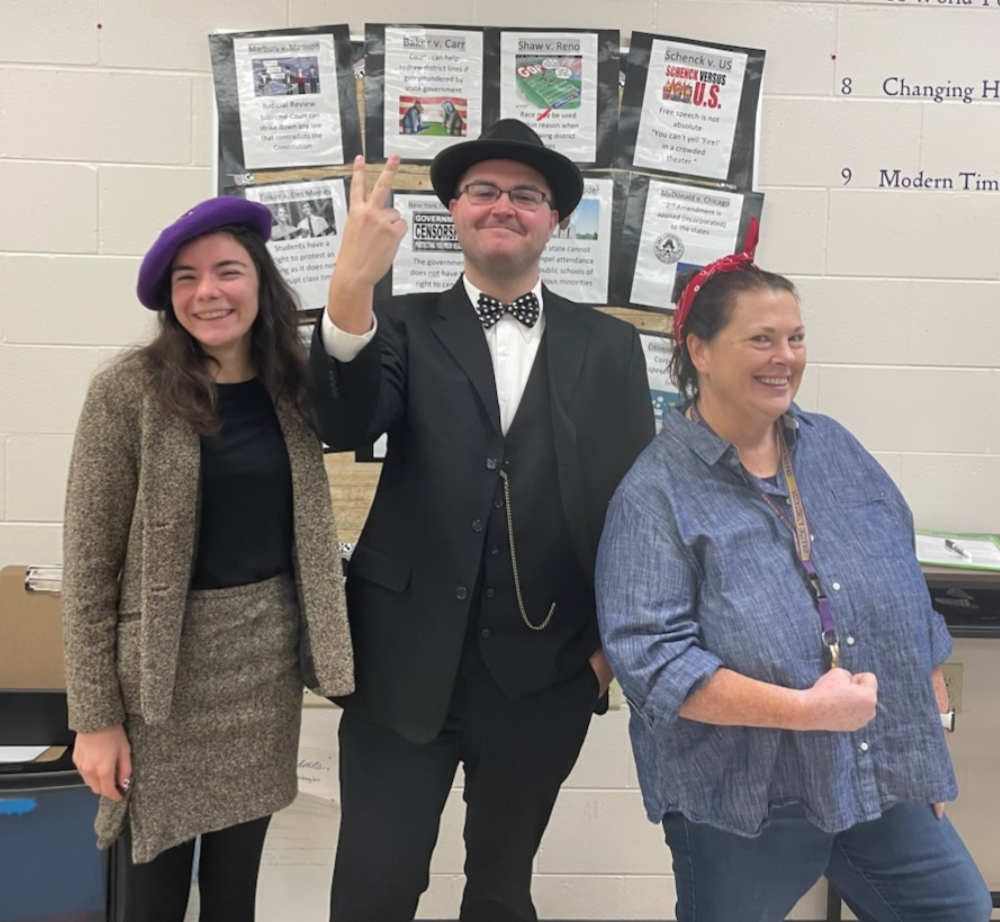 Three teachers dressed as WWII individuals, VirginiaHall, Winston Churchill and Rosie the Riveter