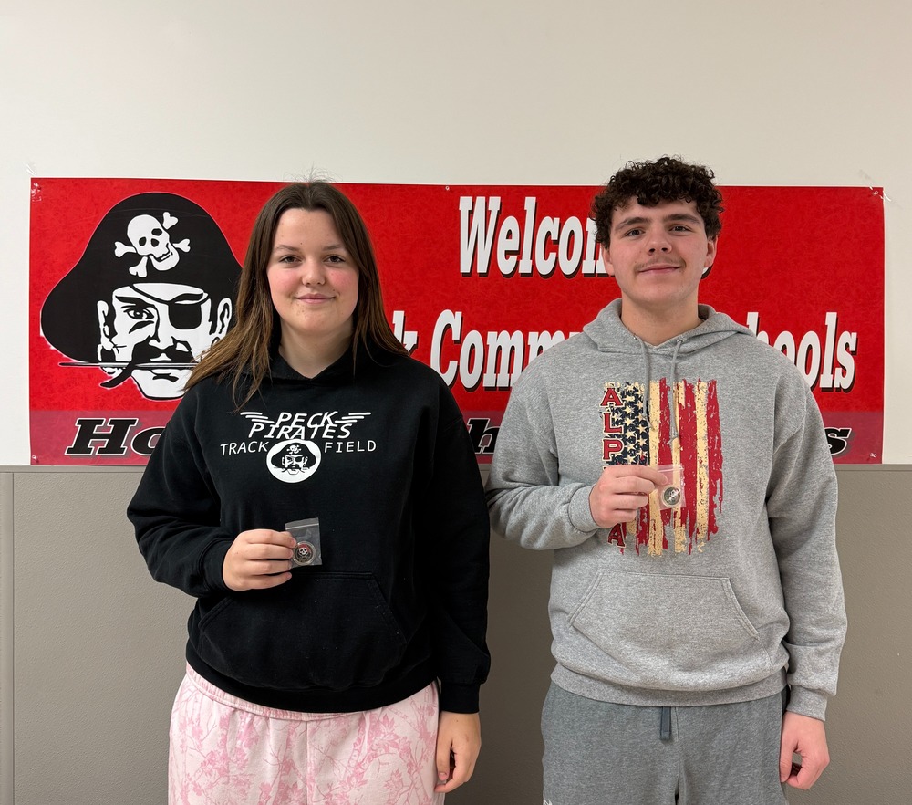 Pictured are two varsity athletes of the month, chosen by the coaches, displaying their medals