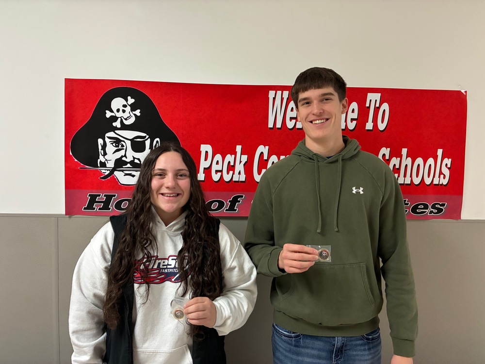 Pictured are two PHS students holding their athlete of the month awards