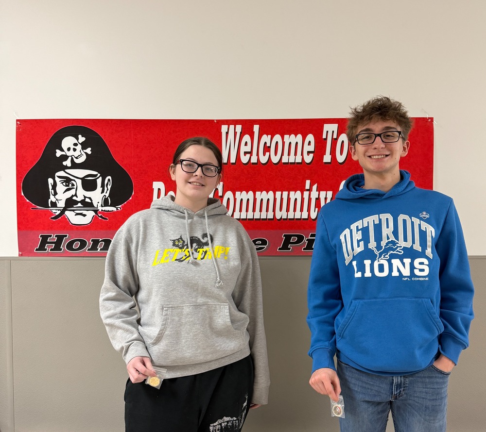 Pictured are two varsity athletes of the month, chosen by the coaches, displaying their medals.