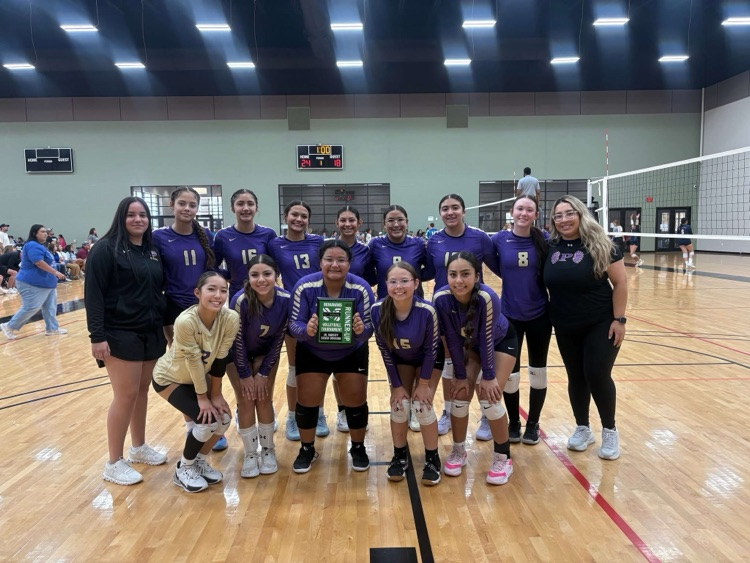 Volleyball JV. Varsity team grouped up together with coaches, showing the Runner-Up plaque award won in the Monahans Volleyball Tournament.