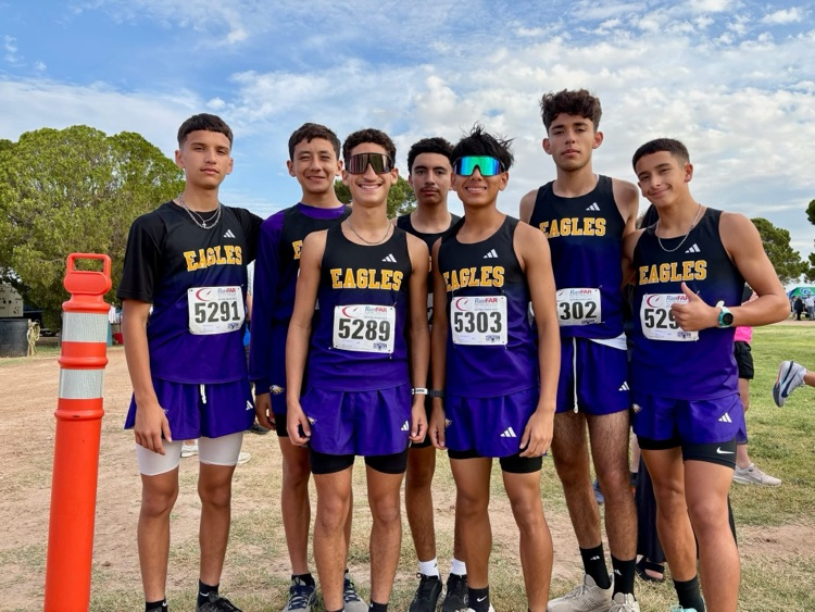 Pecos High School Eagles pictured together as a team smiling. 