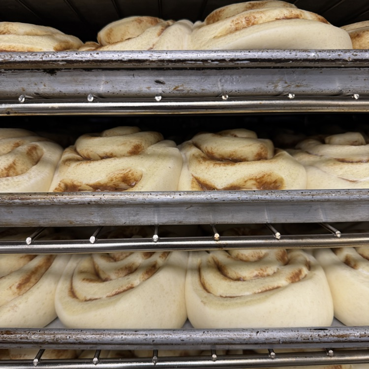 cinnamon rolls cooking in oven