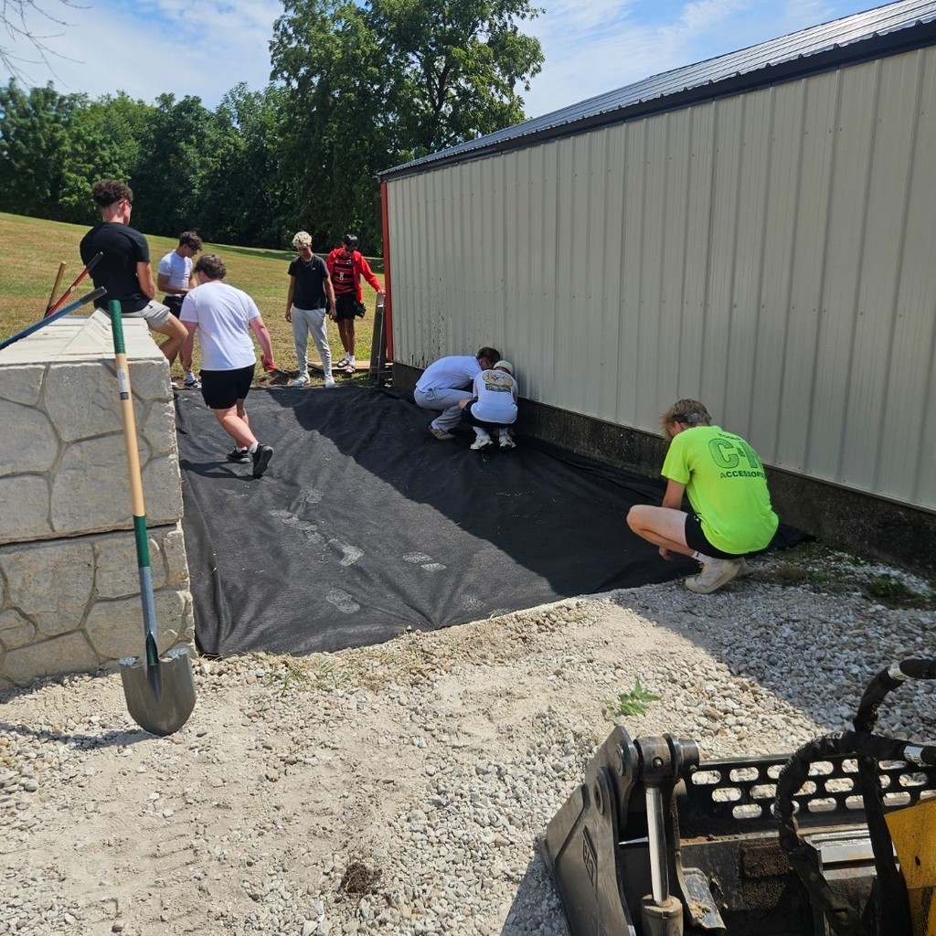 more landscape fabric being stalled