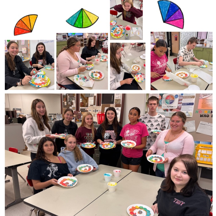 students working on and displaying their edible color wheels