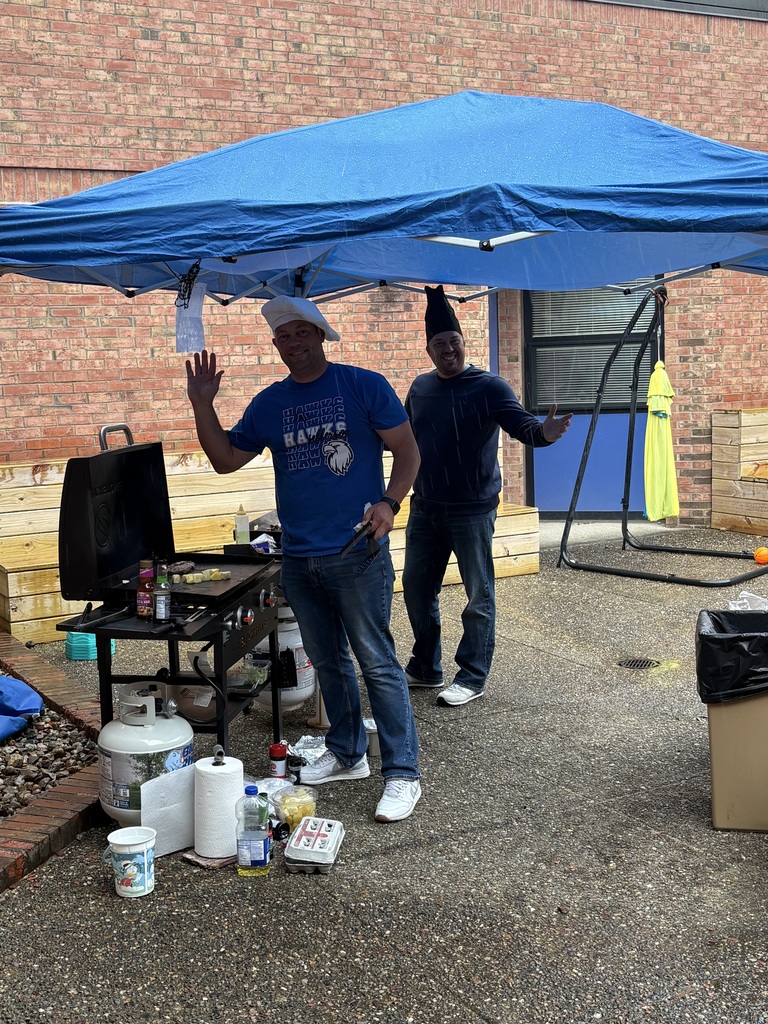 Principals grilling food