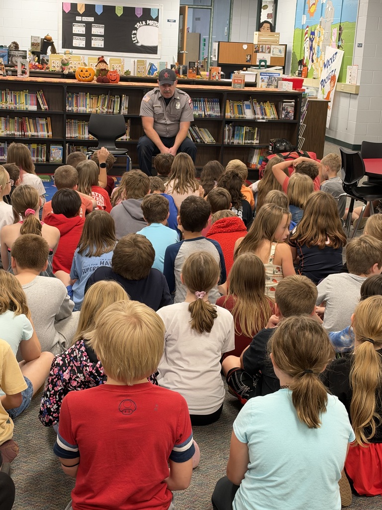 Students watch a fire safety presentation