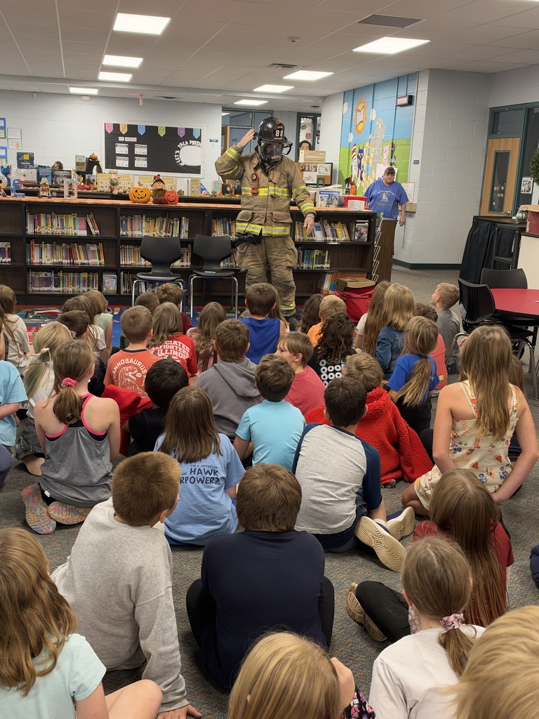 Students watch a fire safety presentation