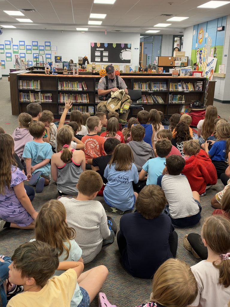 Students watch a fire safety presentation