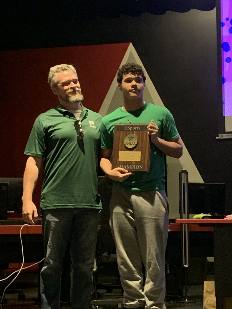 Pelham high school student holding esports state championship trophy