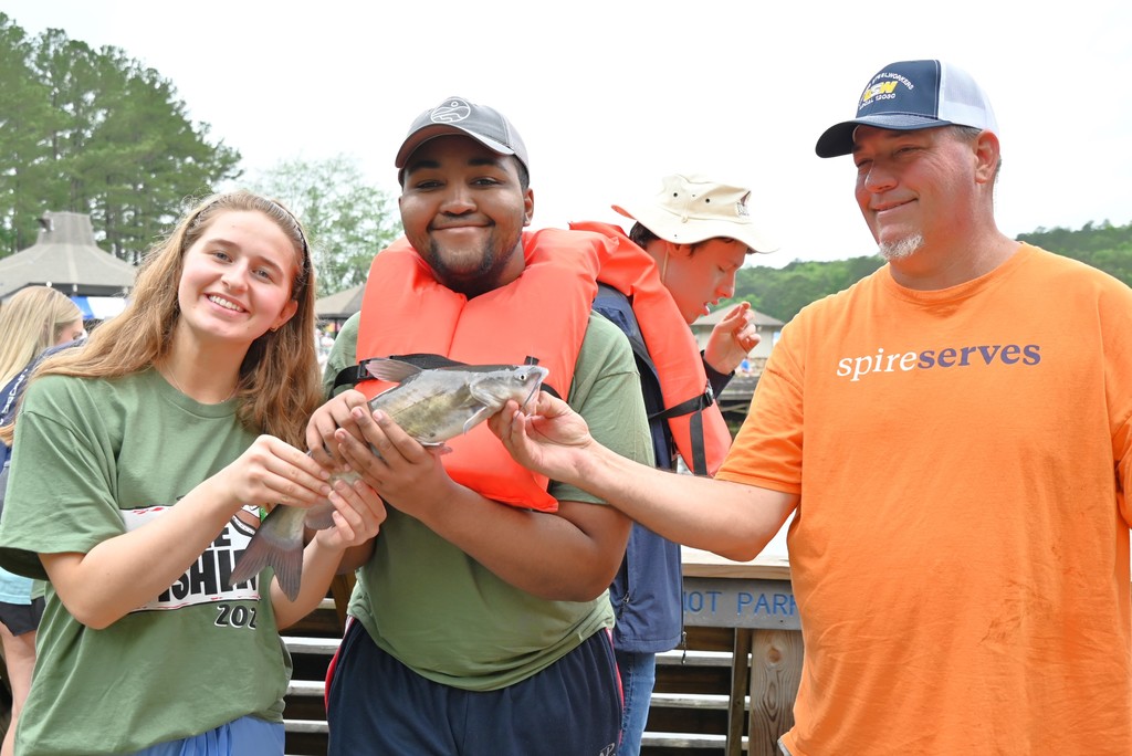 Pelham students holding a fish