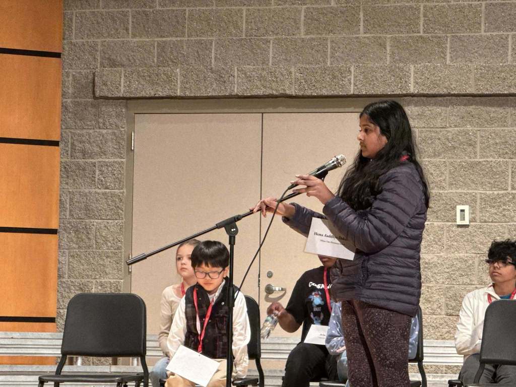 Student at the microphone in regional spelling bee competition