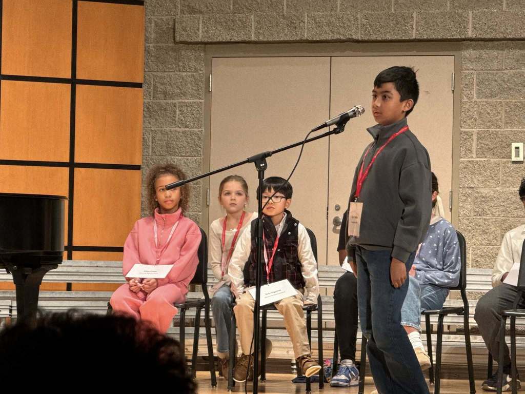 Student at the microphone in regional spelling bee competition
